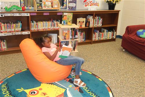 Student reading in a beanbag