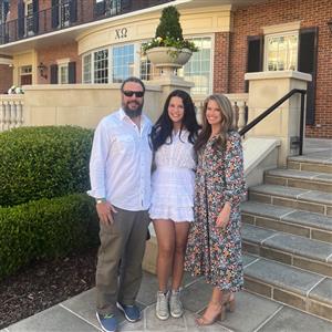 Photo of Mrs. Noble's husband, daughter, and self