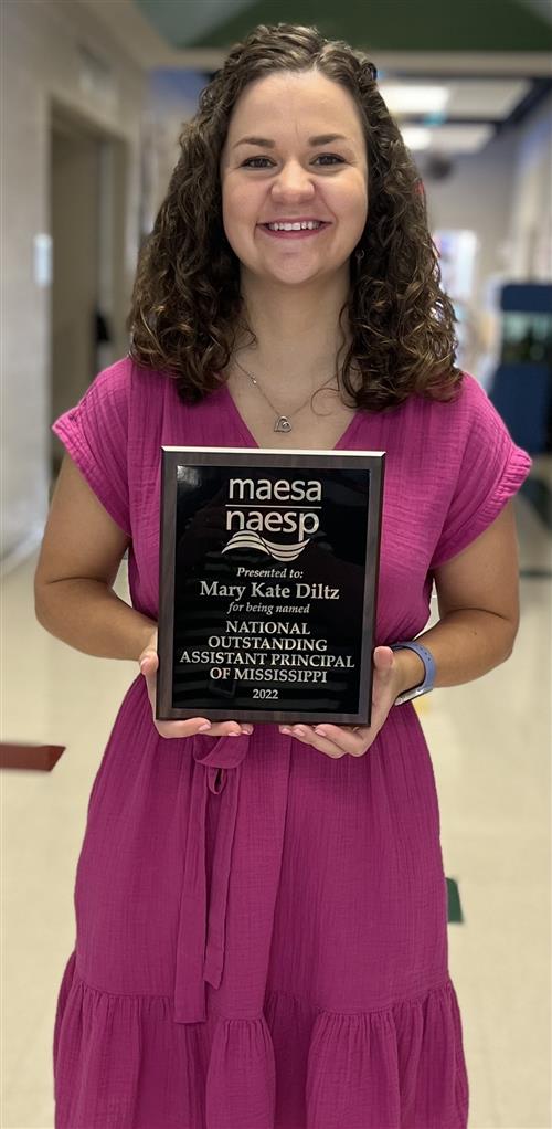 Ms. Diltz with her National Outstanding Assistant Principal of the Year Award 2022