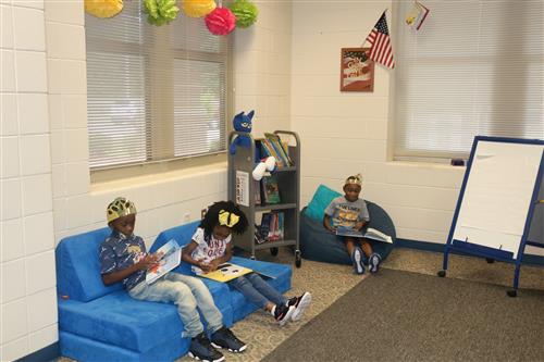 Kids reading books on the carpet
